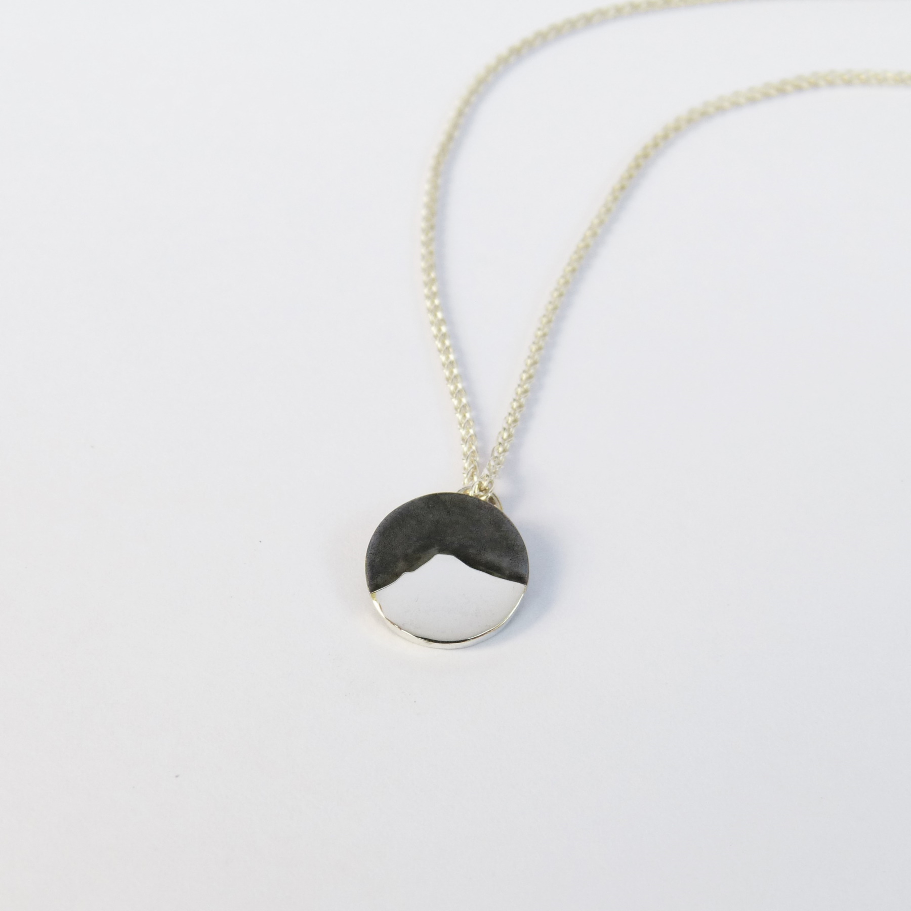 'Goatfell Pendant | Polished and Oxidised' by artist Jen Cunningham